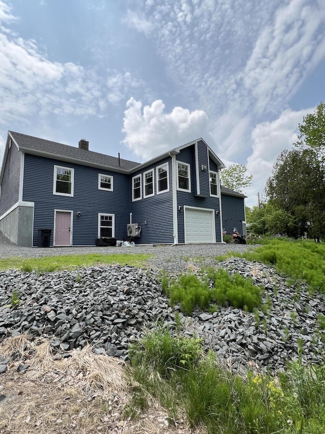 72 Cedar St, Calais, ME 04619 - view of front facade featuring a chimney and a garage