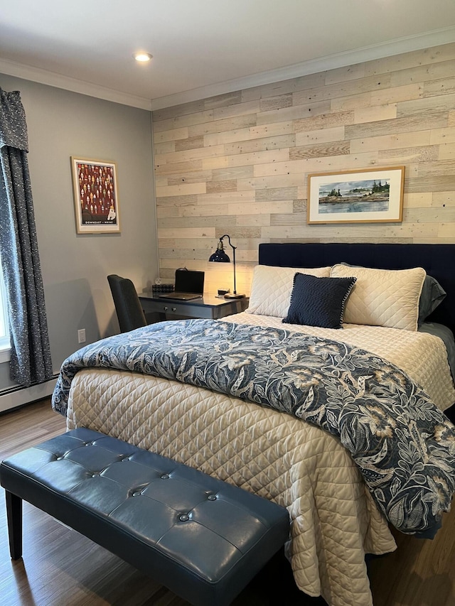 72 Cedar St, Calais, ME 04619 - bedroom with wood finished floors, wooden walls, ornamental molding, recessed lighting, and a baseboard radiator