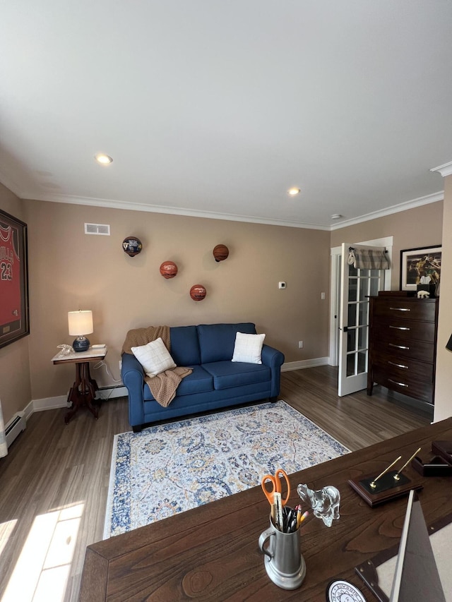 72 Cedar St, Calais, ME 04619 - living area featuring wood finished floors, ornamental molding, and recessed lighting