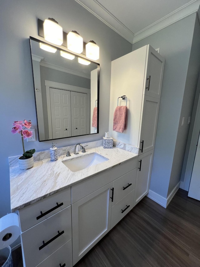 72 Cedar St, Calais, ME 04619 - bathroom with ornamental molding, wood finished floors, and vanity
