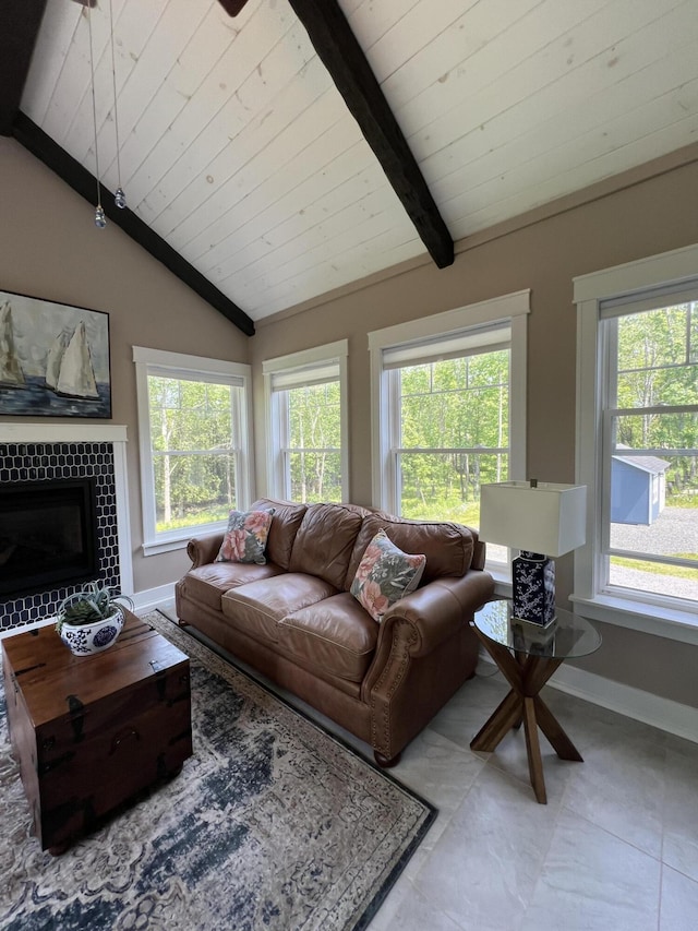 72 Cedar St, Calais, ME 04619 - tiled living area featuring wood ceiling, healthy amount of natural light, and a tile fireplace