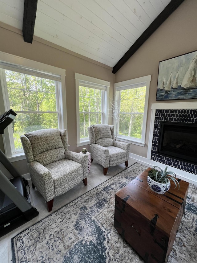 72 Cedar St, Calais, ME 04619 - living area featuring plenty of natural light, wooden ceiling, and a tiled fireplace