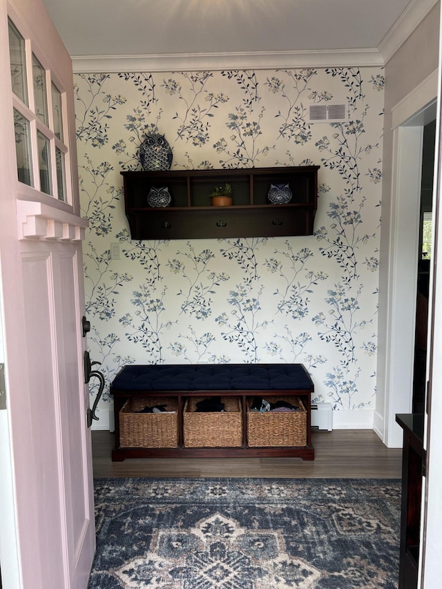 72 Cedar St, Calais, ME 04619 - detailed view of ornamental molding, wallpapered walls, and wood finished floors