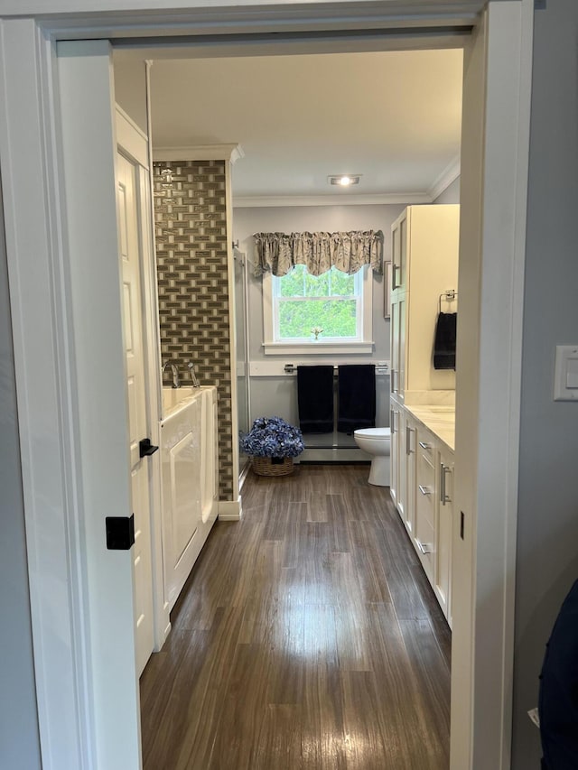 72 Cedar St, Calais, ME 04619 - bathroom featuring ornamental molding, vanity, wood finished floors, and a shower with shower door