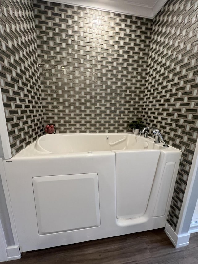 72 Cedar St, Calais, ME 04619 - bathroom with a bath and wood finished floors