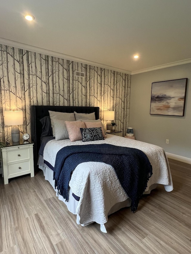 72 Cedar St, Calais, ME 04619 - bedroom featuring wood finished floors, ornamental molding, and recessed lighting