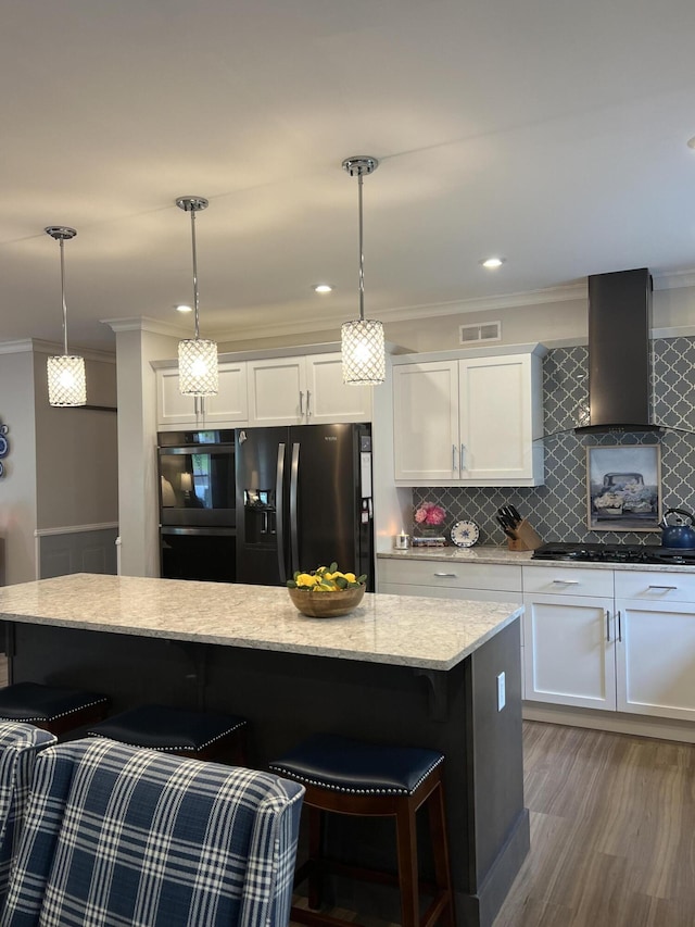 72 Cedar St, Calais, ME 04619 - kitchen featuring black appliances, wall chimney exhaust hood, ornamental molding, backsplash, and white cabinets