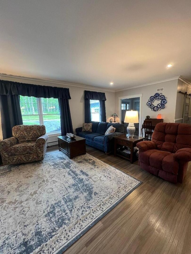 72 Cedar St, Calais, ME 04619 - living room with wood finished floors, crown molding, a baseboard radiator, and recessed lighting