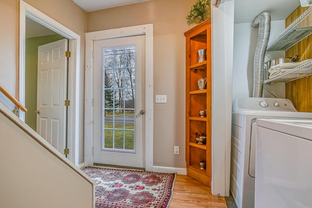 30 Troy Rd, Burnham, ME 04922 - foyer entrance featuring washer / clothes dryer, plenty of natural light, and light wood finished floors