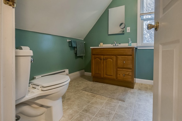 30 Troy Rd, Burnham, ME 04922 - half bathroom with a baseboard heating unit, vanity, lofted ceiling, and tile patterned flooring