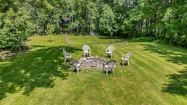 30 Troy Rd, Burnham, ME 04922 - view of green lawn featuring an outdoor fire pit