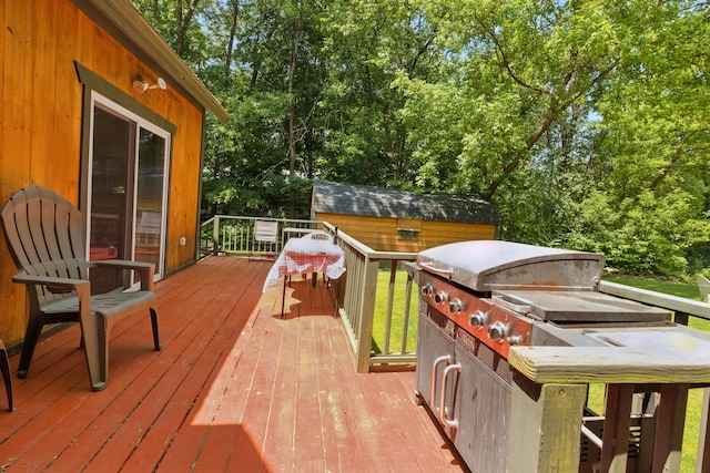 30 Troy Rd, Burnham, ME 04922 - wooden terrace featuring an outdoor structure and view of scattered trees