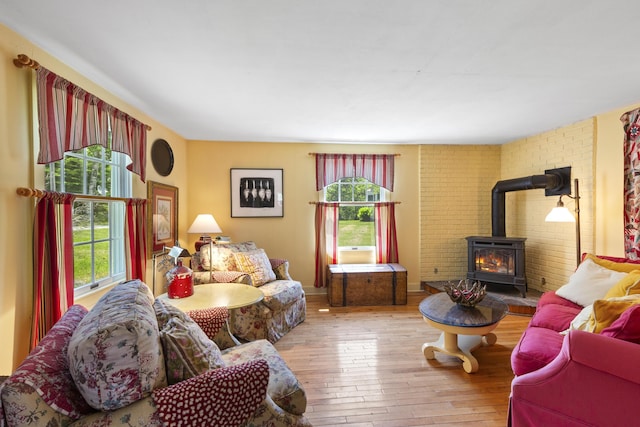 108 Colony Rd, Islesboro, ME 04848 - living room with a wood stove, plenty of natural light, and hardwood / wood-style flooring