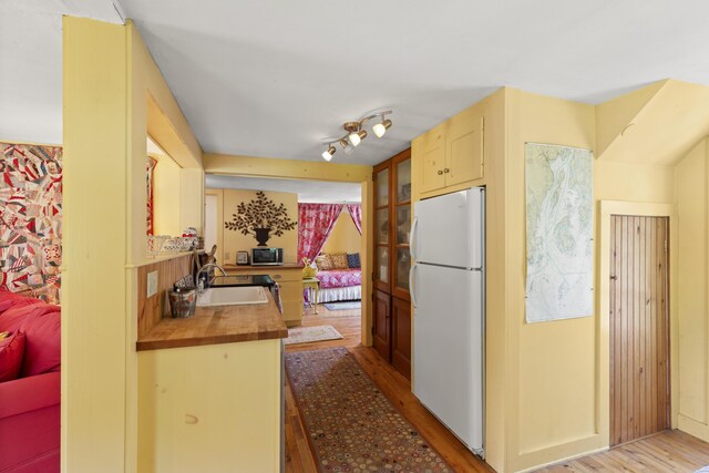108 Colony Rd, Islesboro, ME 04848 - kitchen featuring freestanding refrigerator, light wood finished floors, and butcher block counters