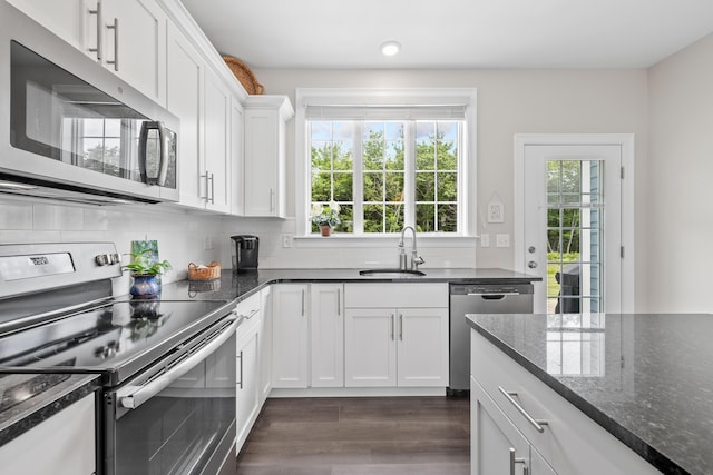 30 Pepperell Way Unit 58, Arundel, ME 04046 - kitchen with stainless steel appliances, healthy amount of natural light, dark wood-style flooring, white cabinetry, and recessed lighting