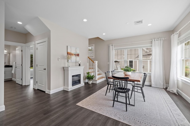 30 Pepperell Way Unit 58, Arundel, ME 04046 - dining area with dark wood-style flooring, recessed lighting, and a glass covered fireplace