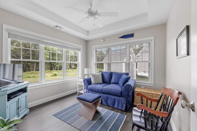 30 Pepperell Way Unit 58, Arundel, ME 04046 - living room with a tray ceiling, wood finished floors, and a ceiling fan