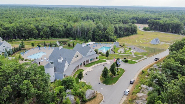 30 Pepperell Way Unit 58, Arundel, ME 04046 - aerial view of property and surrounding area featuring a forest and a pool area