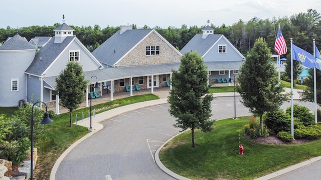 30 Pepperell Way Unit 58, Arundel, ME 04046 - view of front of property with a front lawn and stone siding
