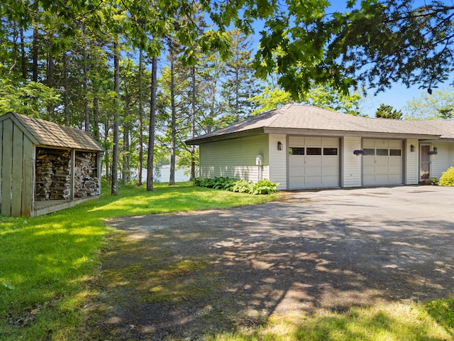 167 Hayden Point Rd, South Thomaston, ME 04858 - view of home's exterior with an outdoor structure, a lawn, and a water view
