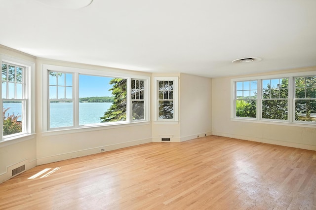 18 Fern Ave, Falmouth, ME 04105 - unfurnished room featuring wood finished floors and a water view