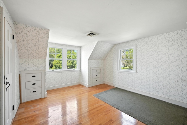 18 Fern Ave, Falmouth, ME 04105 - additional living space with wallpapered walls, healthy amount of natural light, and light wood-type flooring