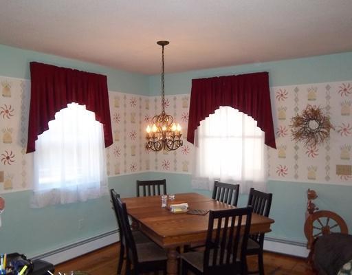 1 Weather Way, Dover-Foxcroft, ME 04426 - dining area featuring wallpapered walls, a chandelier, a baseboard heating unit, and wood finished floors