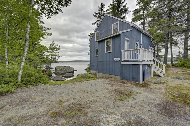 M18L1 Troutdale Rd, The Forks Plt, ME 04985 - view of front facade featuring a water view and stairway