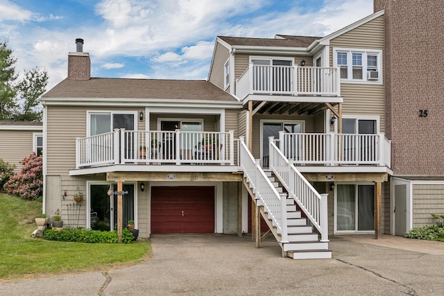25 Riverview Dr Unit D, North Berwick, ME 03906 - view of building exterior featuring driveway and a garage