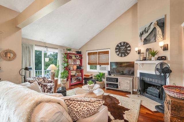 25 Riverview Dr Unit D, North Berwick, ME 03906 - living area with wood finished floors, a tiled fireplace, and high vaulted ceiling