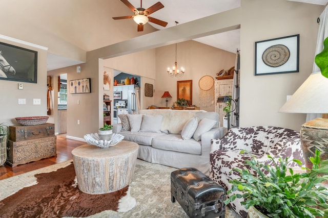 25 Riverview Dr Unit D, North Berwick, ME 03906 - living area with wood finished floors, vaulted ceiling, a chandelier, and a ceiling fan