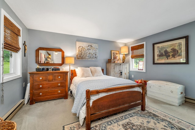 25 Riverview Dr Unit D, North Berwick, ME 03906 - carpeted bedroom with a baseboard radiator and multiple windows