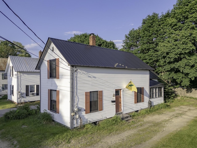 7 Hazen St, Norway, ME 04268 - view of front of property featuring a chimney, a metal roof, and entry steps