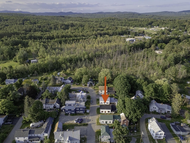 7 Hazen St, Norway, ME 04268 - aerial overview of property's location featuring a forest and a mountain backdrop