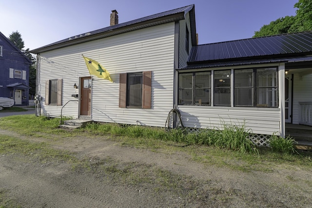 7 Hazen St, Norway, ME 04268 - rear view of house with a metal roof, a chimney, and entry steps