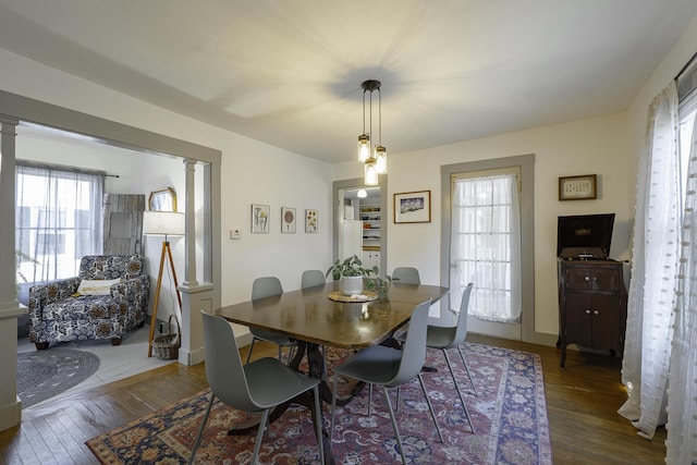 7 Hazen St, Norway, ME 04268 - dining space featuring wood-type flooring, plenty of natural light, and decorative columns