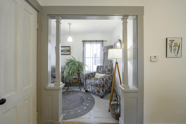 7 Hazen St, Norway, ME 04268 - living area featuring wood finished floors and ornate columns