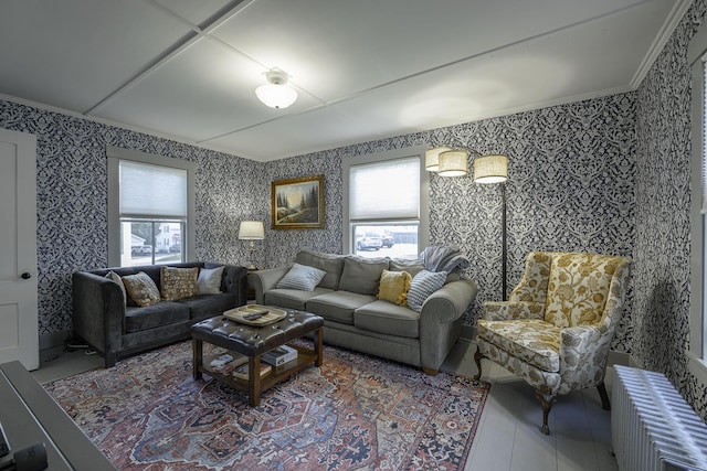 7 Hazen St, Norway, ME 04268 - tiled living room featuring radiator heating unit, healthy amount of natural light, wallpapered walls, and ornamental molding