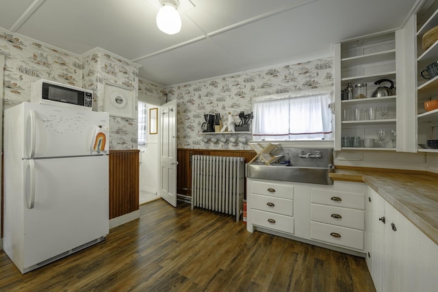 7 Hazen St, Norway, ME 04268 - kitchen with white appliances, radiator, wallpapered walls, open shelves, and dark wood-style flooring