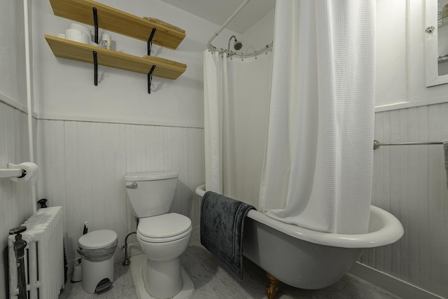 7 Hazen St, Norway, ME 04268 - full bathroom featuring radiator, wainscoting, shower / bath combination with curtain, and wooden walls
