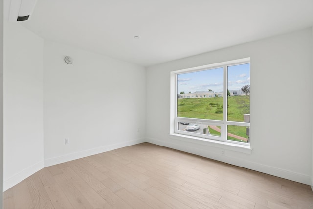 218 Washington Ave Unit 207, Portland, ME 04101 - spare room featuring light wood finished floors and baseboards