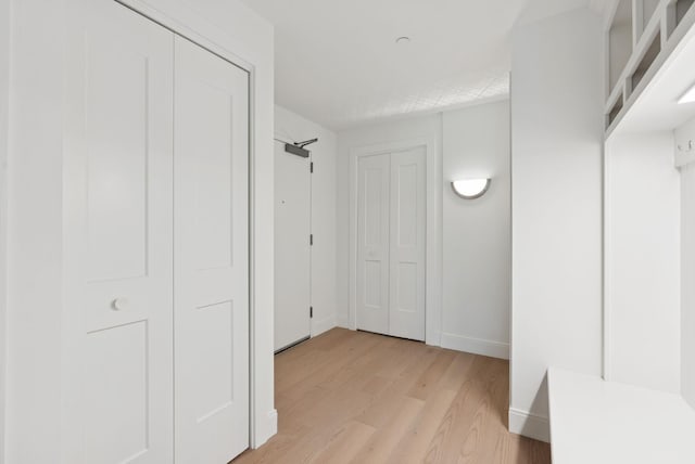 218 Washington Ave Unit 207, Portland, ME 04101 - corridor featuring light wood-type flooring and baseboards