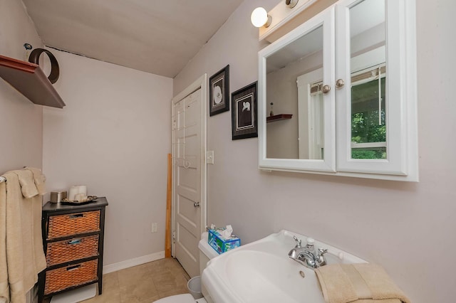 12 Court St, Rochester, NH 03867 - bathroom featuring tile patterned floors and a sink