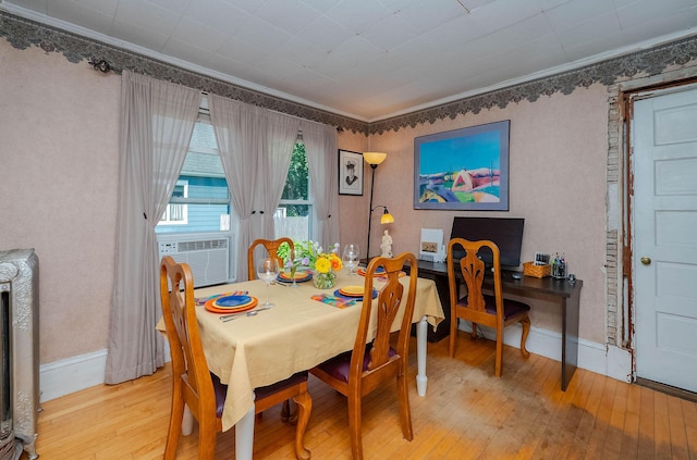 12 Court St, Rochester, NH 03867 - dining room with light wood-style flooring, cooling unit, and ornamental molding