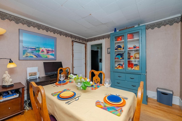 12 Court St, Rochester, NH 03867 - dining area with wood finished floors and crown molding