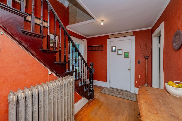 12 Court St, Rochester, NH 03867 - entryway featuring wood finished floors, stairway, and ornamental molding