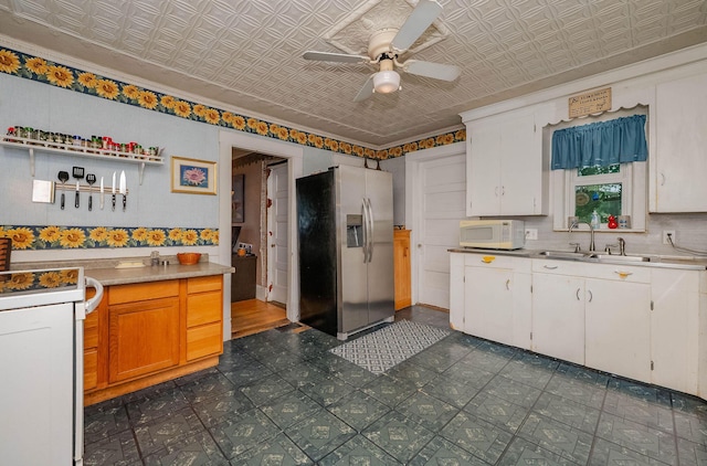 12 Court St, Rochester, NH 03867 - kitchen featuring white appliances, an ornate ceiling, ceiling fan, dark flooring, and light countertops
