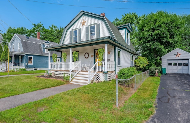 12 Court St, Rochester, NH 03867 - colonial inspired home featuring a porch, a gambrel roof, an outbuilding, a chimney, and a garage