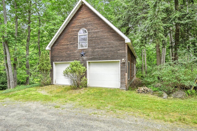 15 Loon Call Dr, Belgrade, ME 04917 - view of home's exterior with a detached garage and an outdoor structure