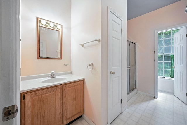 15 Loon Call Dr, Belgrade, ME 04917 - full bath featuring vanity, plenty of natural light, and a shower with door